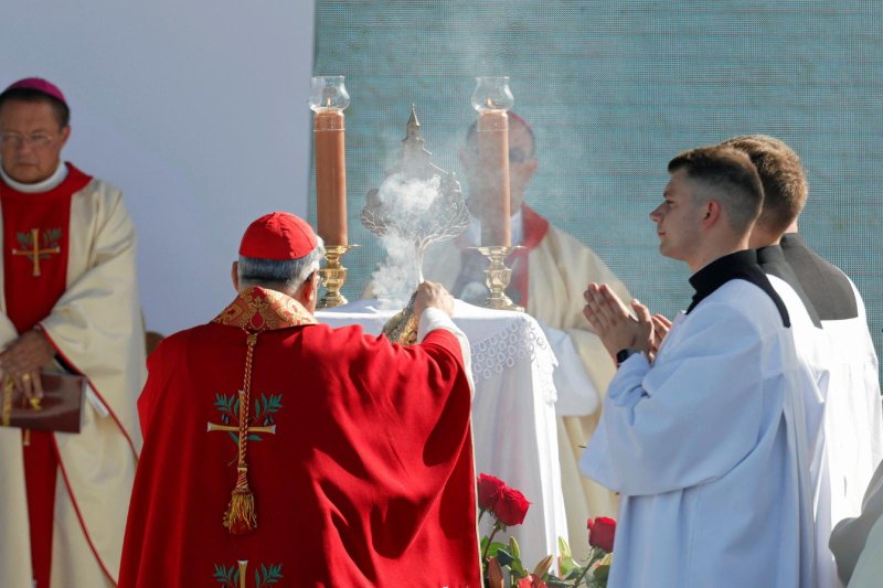 Cardinal Marcello Semeraro, papal envoy, swings a censer over the altar as he concelebrates the Sept. 10, 2023, beatification Mass of the Ulma family, who were martyred in Markowa, Poland, for sheltering Jews under German occupation during World War II. Józef and Wiktoria and their seven children were proclaimed "Blessed" during the Mass. The Ulmas' seventh child was born as Wiktoria was executed. (OSV News photo/Patryk Ogorzalek/Agencja Wyborcza.pl via Reuters)