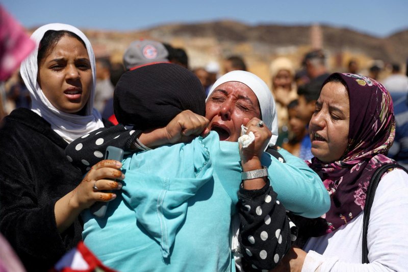A woman grieves Sept. 10, 2023, during a funeral in Moulay Brahim, Morocco, for two victims of a deadly magnitude 6.8 earthquake. An aftershock rattled Moroccans that day as they mourned victims of the nation's strongest earthquake in more than a century Sept. 8, killing more than 2,000 people, a number that is expected to rise. (OSV News/Hannah McKay, Reuters)