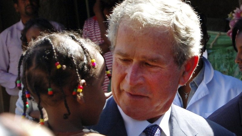 Former U.S. President George W. Bush carries an Ethiopian child whose mother is receiving HIV treatment through programs funded by the President's Emergency Plan for AIDS Relief, or PEPFAR, after arriving in the capital Addis Ababa Dec. 4, 2011. (OSV News/Aron Maasho, Reuters)