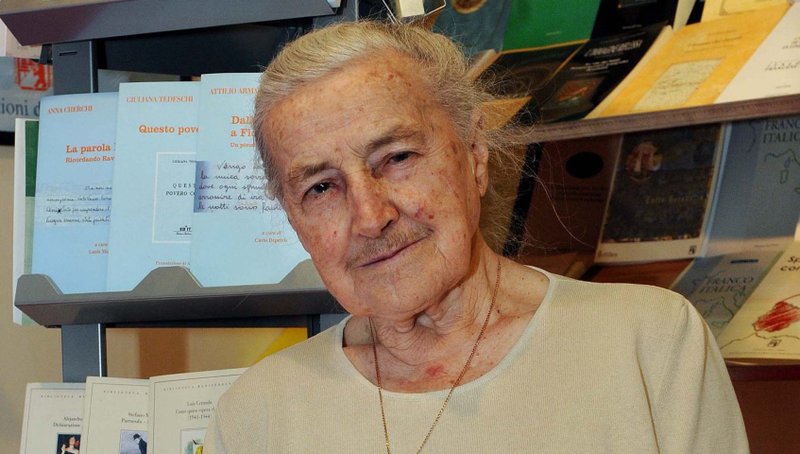 Wanda Poltawska, a longtime friend and adviser to Pope John Paul II, holds a copy of a book she wrote, in a bookstore in Turin, Italy, in this May 12, 2008 file photo. (CNS/Guglielmo Lobera, Catholic Press Photo)