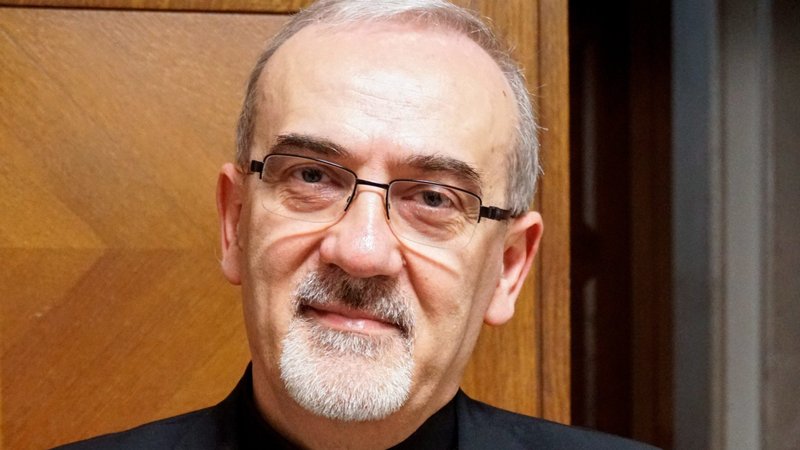 Cardinal Pierbattista Pizzaballa, the Latin patriarch of Jerusalem, poses for a photo while speaking to reporters at the Vatican Sept. 28, 2023. (CNS/Carol Glatz)