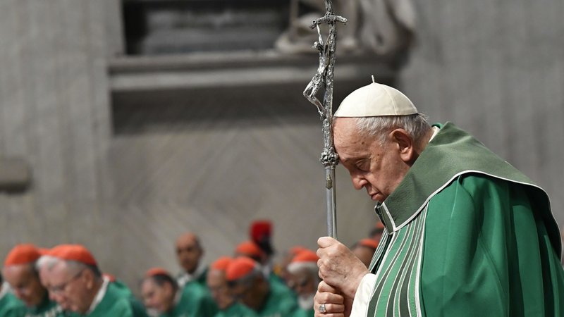 Pope Francis prays while holding a crosier during Mass in St. Peter's Basilica at the Vatican Oct. 29, 2023, marking the conclusion of the first session of the Synod of Bishops on synodality. (CNS/Vatican Media)