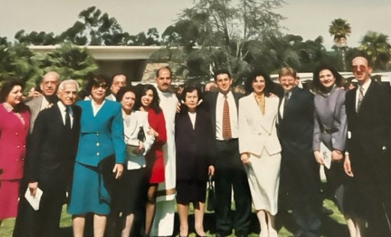 Bishop Albert Bahhuth poses with several family, friends, and loved ones after he was ordained as a deacon in the 1990s. (Submitted photo)