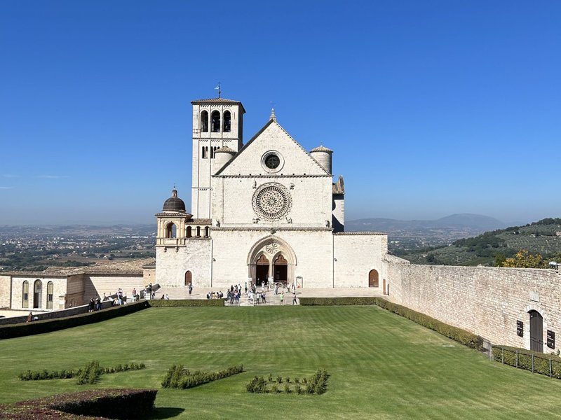 A view of the Basilica of St. Francis in Assisi, Italy, with the Umbrian countryside in the background. (Elise Ureneck)