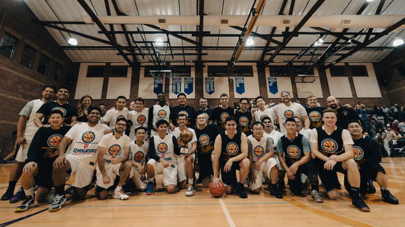 Both LA seminarians and LA priests squads pose together at the Priests vs. Seminarians Basketball Game Oct. 13 at Cathedral High School. (Peter Lobato)