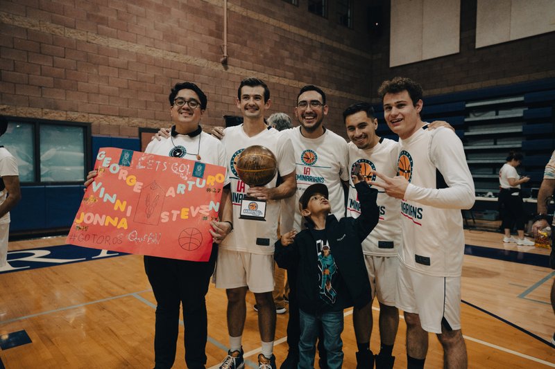LA seminarians pose after defeating the LA priests, 47-43, on Oct. 13 at Cathedral High School. (Peter Lobato)