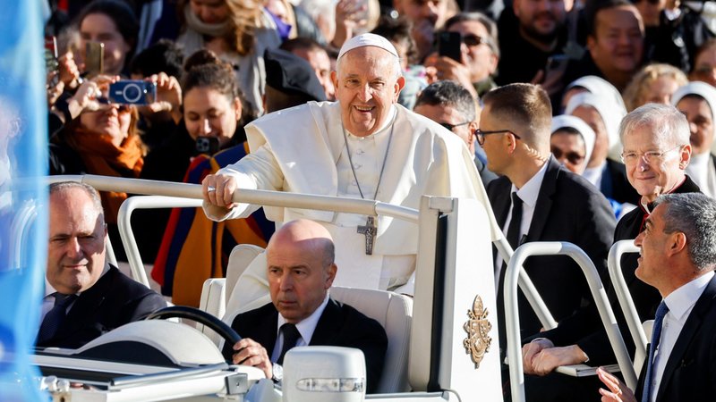 Pope Francis smiles as he rides the popemobile around St. Peter's Square at the Vatican before his weekly general audience Nov. 8, 2023. (CNS/Lola Gomez)