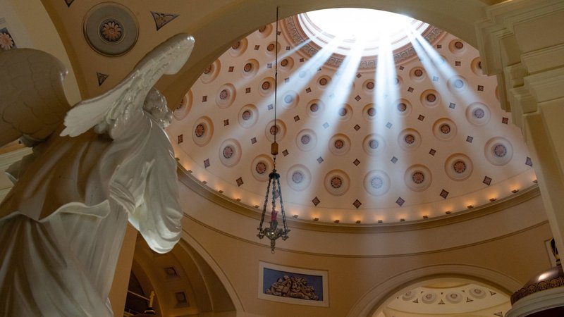 The afternoon sun shines through the dome of the Basilica of the National Shrine of the Assumption of the Blessed Virgin Mary in Baltimore May 31, 2021. The U.S. bishops gathered at the historic basilica Nov. 13, 2023, for a Mass of peace on the first day of their fall plenary assembly. The bishops face a packed agenda for the public sessions of the assembly Nov. 14 and 15. (CNS/Kevin J. Parks, Catholic Review)