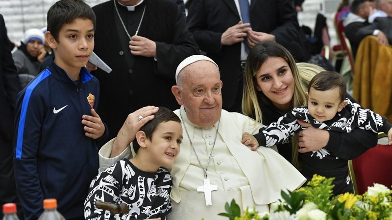 Pope Francis poses for a photo with his guests during a lunch in the Vatican audience hall Nov. 19, 2023, the World Day of the Poor. (CNS/Vatican Media)