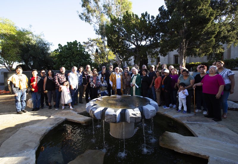 Celebrants, along with Los Angeles Auxiliary Bishop Brian Nunes, pose during a dedication for a new Native garden space and fountain at Mission San Gabriel Arcángel on Nov. 19. (Victor Alemán)