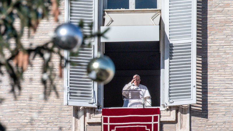 Pope Francis gives his blessing to visitors gathered in St. Peter's Square at the Vatican after praying the Angelus Dec. 10, 2023. (CNS photo/Vatican Media)