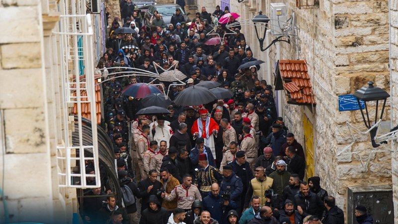 Latin Patriarch of Jerusalem Cardinal Pierbattista Pizzaballa and Cardinal Konrad Krajewski, prefect of the Vatican Dicastery for the Service of Charity, arrive in Bethlehem, on the West Bank, Dec. 24, 2023, to mark Christmas celebrations at a difficult time for Palestinian Christians amid ongoing Israel-Hamas war. (OSV News/courtesy Latin Patriarchate of Jerusalem)