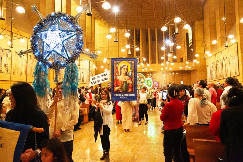 Parishioners from parishes across the Archdiocese of Los Angeles processed in before the annual Simbang Gabi kickoff Mass Dec. 15 at the Cathedral of Our Lady of the Angels. (Victor Alemán)