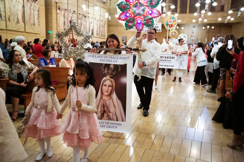 Parishioners from parishes across the Archdiocese of Los Angeles processed in before the annual Simbang Gabi kickoff Mass Dec. 15 at the Cathedral of Our Lady of the Angels. (Victor Alemán)