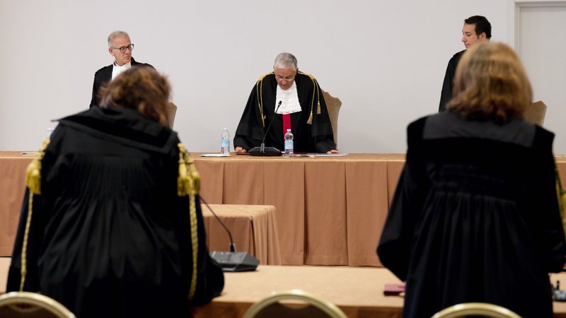 Giuseppe Pignatone, president of the Vatican City criminal court, reads the verdict at the end of the first trial of Father Gabriele Martinelli on charges of sexually abusing a younger student at the St. Pius X Pre-Seminary in the Vatican in this file photo from Oct. 6, 2021. (CNS/Vatican Media)