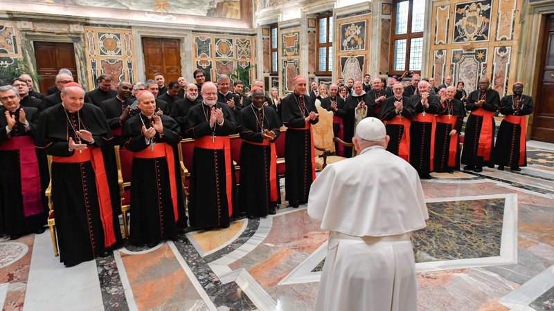 Pope Francis meets members of the Dicastery for the Doctrine of the Faith in the Apostolic Palace at the Vatican Jan. 26, 2024. In the front row from left are: Cardinals Christoph Schönborn, Robert Prevost, Seán P. O'Malley, Peter Turkson, Victor Manuel Fernández, Claudio Gugerotti, Marc Ouellet, Fernando Filoni, John Onaiyekan and Stephen Mulla. (CNS/Vatican Media)