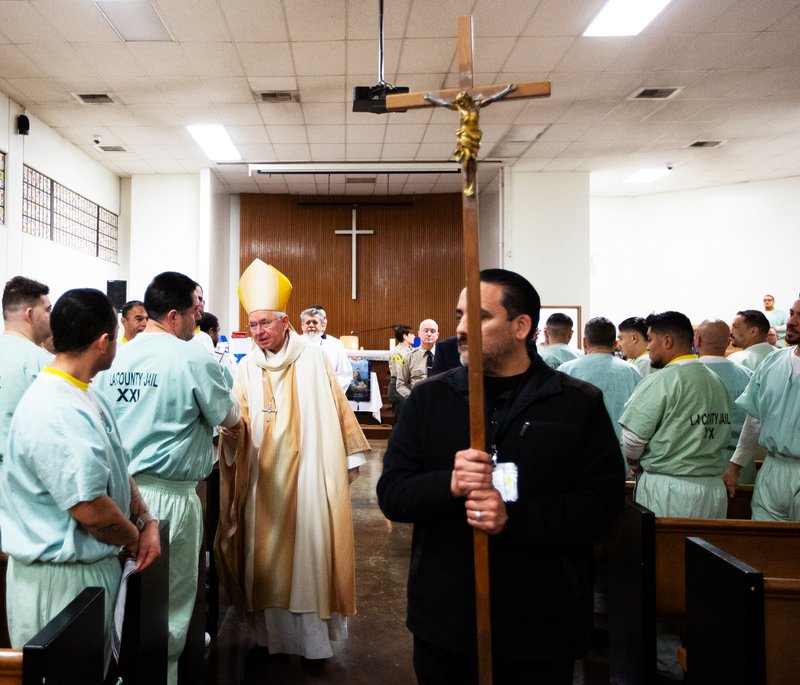 Los Angeles Archbishop José H. Gomez greets inmates at Men’s Central Jail in Los Angeles after celebrating Christmas Mass the morning of Dec. 25. (Victor Alemán)
