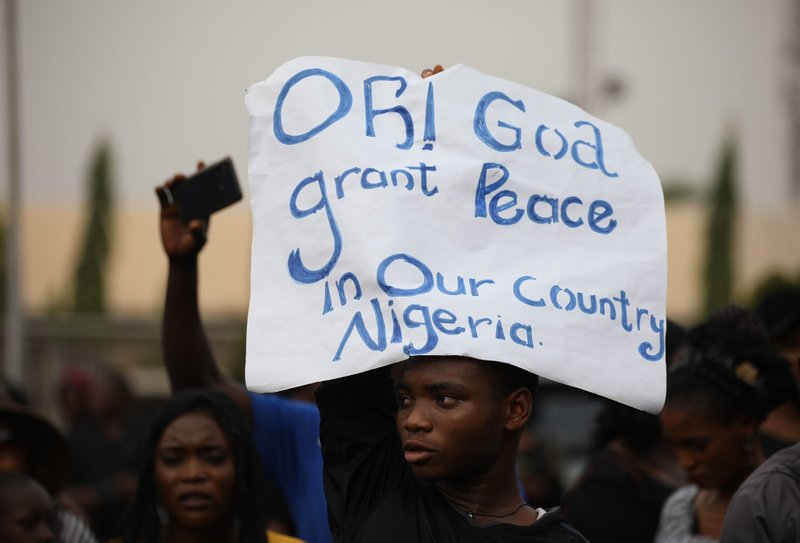 Christians hold signs as they march on the streets of Abuja during a prayer and penance for peace and security in Nigeria in Abuja on March 1, 2020. The Catholic bishops of Nigeria gathered faithful as well as other Christians and other people to pray for security and to denounce the barbaric killings of Christians by the Boko Haram insurgents and the incessant cases of kidnapping for ransom in Nigeria. (Kola Sulaimon/AFP/Getty)