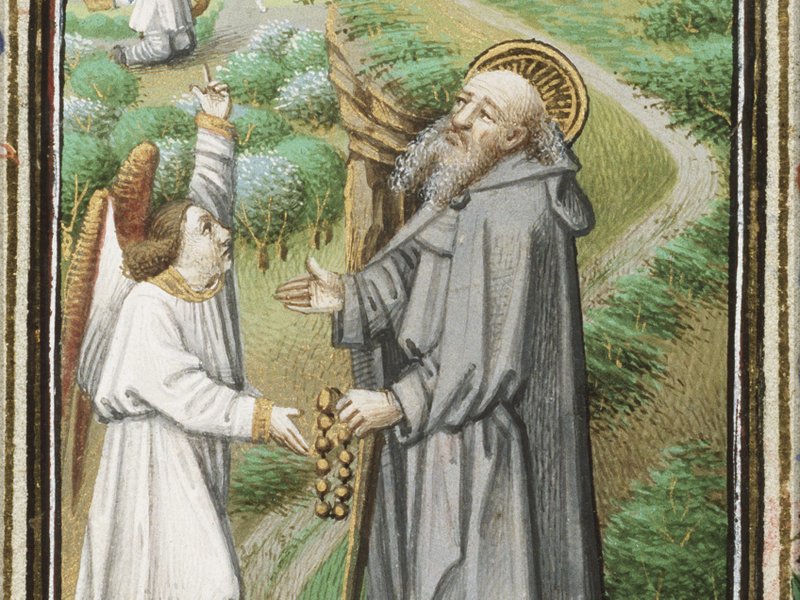 “St. Anthony of Egypt holding a rosary and a staff, with an angel — miniature from the Book of Hours of Simon de Varie,” by Getijdenboek van Simon de Varie, Master of Jean Rolin II, 15th century, French. (Wikimedia Commons)