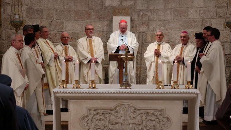 Cardinal Timothy M. Dolan of New York, center, offers Mass at the Our Lady of Peace chapel in the Notre Dame of Jerusalem Center April 13, 2024. The cardinal was reportedly safe in Jerusalem amid Iran's unprecedented missile and drone attacks on Israel that began later that evening. (OSV News photo/Sinan Abu Mayzer, Reuters)