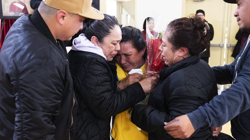 A reunited family tearfully hugs after seeing one another for the first time in decades during a special event at St. Frances X. Cabrini Church in South LA on March 30. (Victor Alemán)