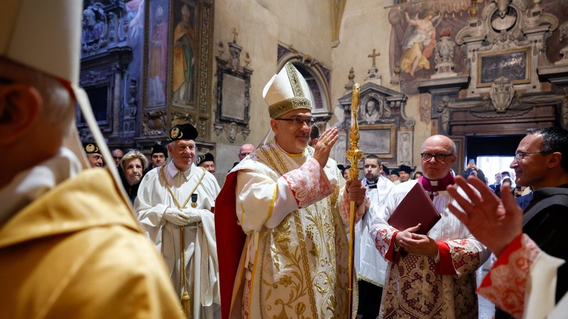 Cardinal Pierbattista Pizzaballa, patriarch of Jerusalem, greets the faithful before celebrating Mass in Rome to formally take possession of his titular church, the Church of St. Onuphrius on the Janiculum, May 1, 2024. (CNS photo/Lola Gomez)