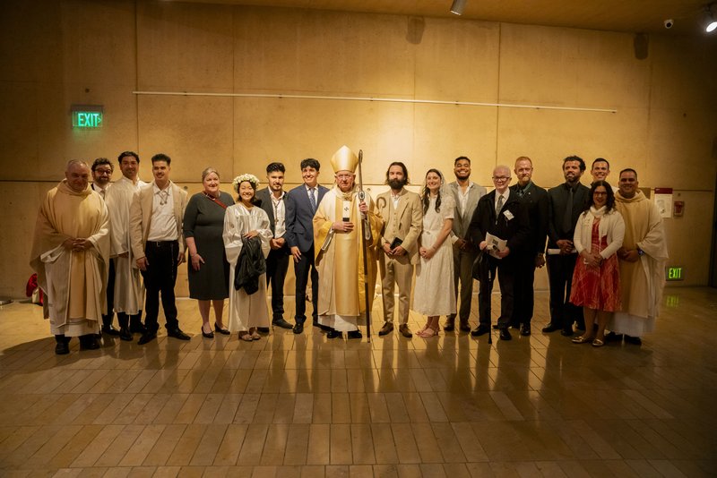 Archbishop José H. Gomez with the adult catechumens and candidates welcomed into the Catholic Church at the Easter Vigil at the Cathedral of Our Lady of the Angels March 29. (Archdiocese of LA)