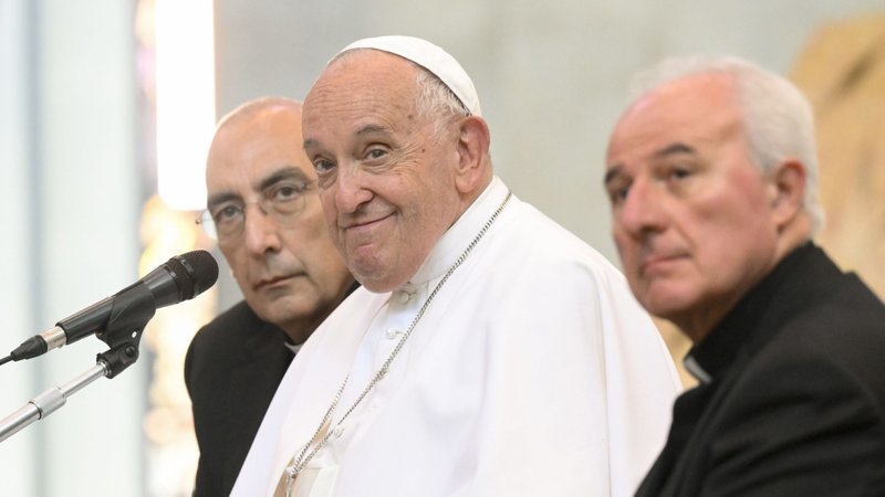 Pope Francis listens to a question during a meeting with young priests ministering in the Diocese of Rome May 29. The pope is seated between Rome Auxiliary Bishops Baldo Reina, left, and Michele Di Tolve, right. (CNS/Vatican Media)