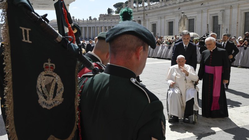 Pope Francis greets members of the British Army's Royal Irish Regiment in St. Peter's Square during his general audience at the Vatican June 12, 2024. The regiment visited the Vatican with the 38th (Irish) Brigade to mark the 80th anniversary of the liberation of Rome from Nazi occupation and the brigade's audience with Pope Pius XII on June 12, 1944. (CNS photo/Vatican Media)