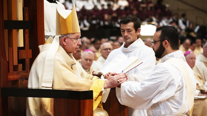 Alejandro Reynaga joins his hands in obedience to Archbishop Gomez during the ordination to the priesthood of Reynaga and ten others June 1, 2024. (Victor Alemán)