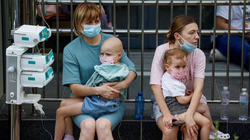 Women hold patients outside Okhmatdyt Children's Hospital in Kyiv, Ukraine's capital, July 8, 2024, after it was severely damaged during Russian missile strikes amid Russia's war on Ukraine. At least 31 were killed and over 135 injured as Russian bombers pummeled Kyiv and numerous other cities throughout the nation that day with more than 40 missiles and guided aerial bombs, with one striking the large children's hospital, where emergency crews searched the rubble for victims. (OSV News photo/Gleb Garanich, Reuters)