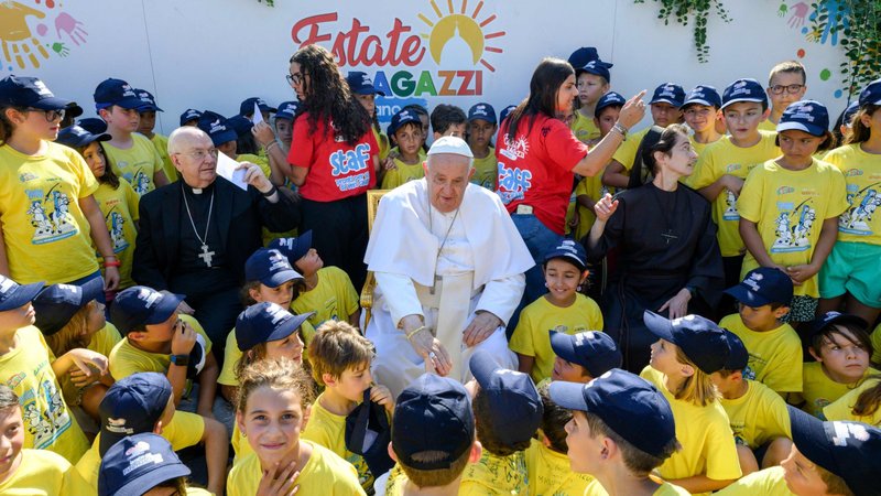 Pope Francis greets children of Vatican employees attending a summer camp at the Vatican July 18, 2024. Also in the photo are, to the pope's left, Cardinal Fernando Vérgez Alzaga, president of the commission governing Vatican City State, and, to the pope's right, Sister Raffaella Petrini, secretary-general of the commission and a member of the Franciscan Sisters of the Eucharist. (CNS photo/Vatican Media)