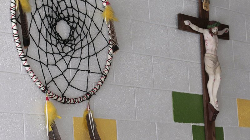 A dream catcher and crucifix are seen on the wall at St. Anthony Indian School on the Zuni Pueblo Indian reservation in New Mexico in late October. (CNS photo/Bob Roller) (Jan. 4, 2012) See BUREAU-PAYSSE and BUREAU-EDUCATION Jan. 4, 2012.