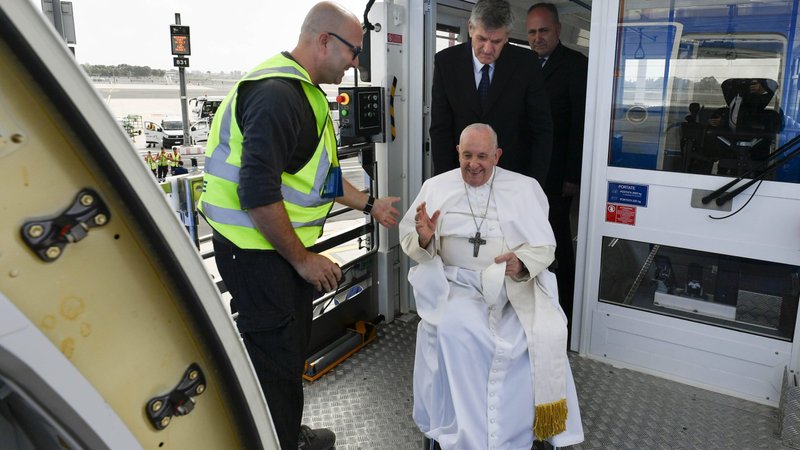 Pope Francis is seated in a wheelchair as he gets off a lift to board his flight to Marseille, France, from Rome's Fiumicino airport in this file photos from Sept. 22, 2023. After almost a year without traveling outside Italy, he will visit Indonesia, Papua New Guinea, Timor-Leste and Singapore Sept. 2-13. (CNS photo/Vatican Media)