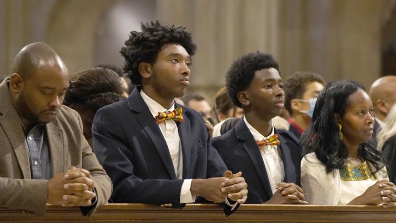 A family prays during the Archdiocese of New York's annual Black History Month Mass at St. Patrick's Cathedral in New York City Feb. 5, 2023. The liturgy also marked the National Day of Prayer for the African American and African Family. (OSV News photo/Gregory A. Shemitz)