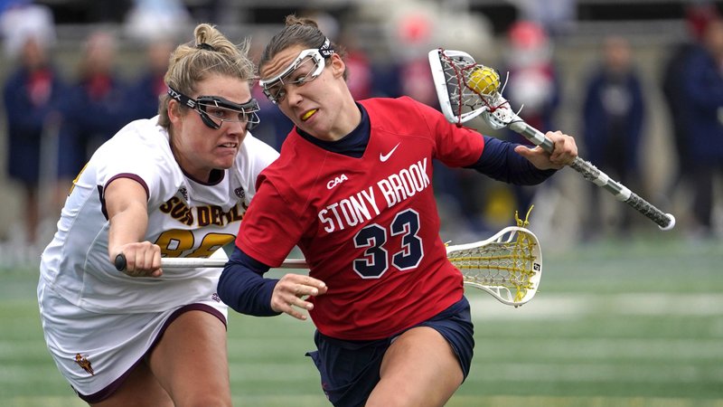 Stony Brook's Courtney Maclay maintains possession of the ball against Arizona State's Zoe Mazur during an NCAA women's lacrosse game in Stony Brook, N.Y., Feb. 23, 2024. The Supreme Court Aug. 16 temporarily blocked a Biden administration rule to expand Title IX's prohibition on sex discrimination to include sexual orientation and gender identity. The 1972 federal civil rights law requires that women and girls have equal access and treatment in education and athletics. (OSV News photo/Gregory A. Shemitz)