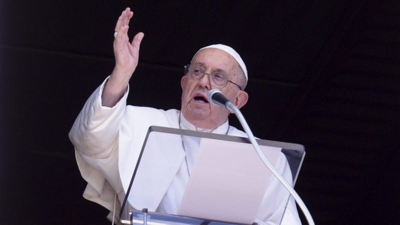 Pope Francis gives his blessing to visitors in St. Peter's Square at the Vatican after the midday recitation of the Angelus prayer Aug. 25, 2024. (CNS photo/Vatican Media)