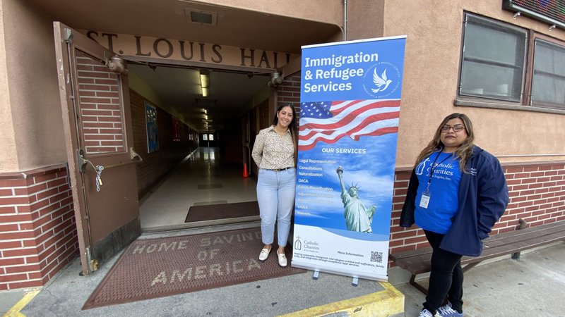 Jaqueline Perez Herrera Alonso, left, and Mirna Sanchez of Catholic Charities Los Angeles pose at a Citizenship Workshop at St. Louis of France in La Puente. (Theresa Cisneros)