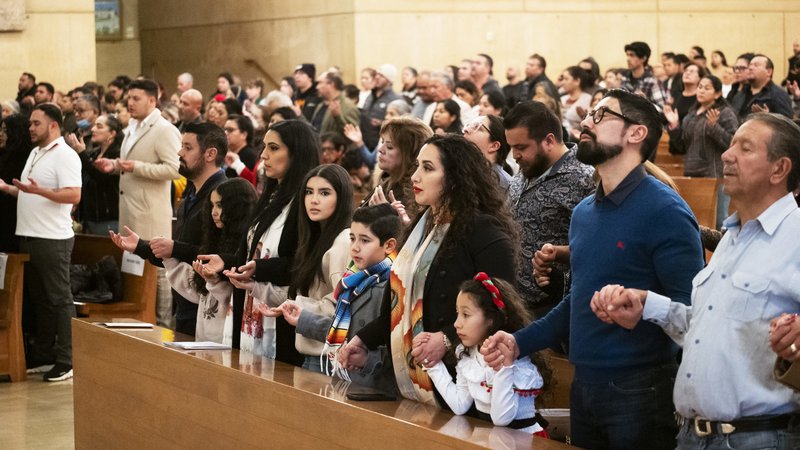 Faihful pray during the annual “Las Mañanitas” celebration at the Cathedral of Our Lady of the Angels on Dec. 11, 2023. (Victor Alemán)