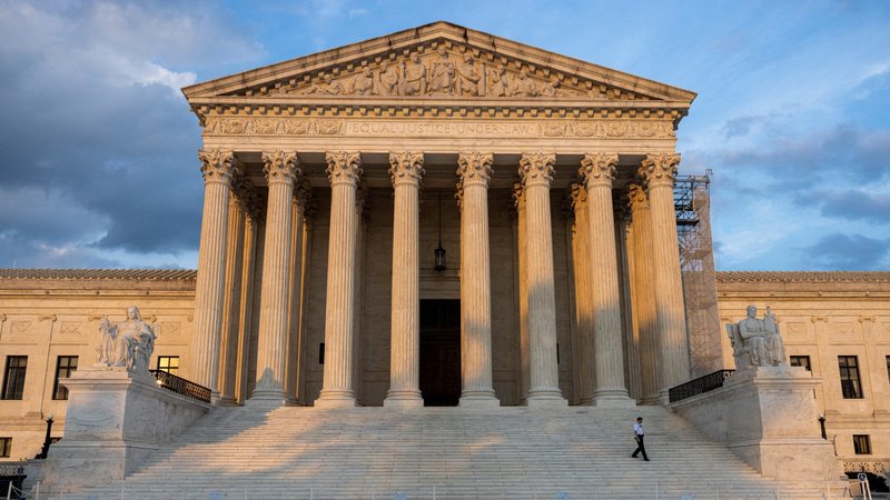 A security guard walks down the steps of the U.S. Supreme Court in Washington July 19, 2024. (OSV News photo/Kevin Mohatt, Reuters)