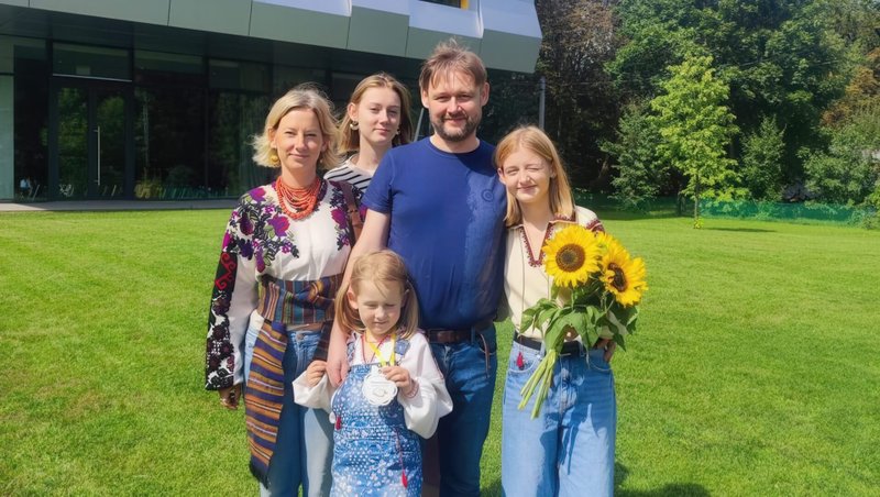 Ukrainian Catholic University student Daryna Bazilevich (with flowers) stands with her family on the the school's campus in this undated photo. Daryna, 18, her mother, Evgenia, and her two sisters, Emilia and Yaryna, ages 7 and 21, were among those killed in a Sept. 4, 2024, strike by Russia on the western Ukrainian city of Lviv. Daryna was a sophomore at UCU in Lviv. Her father, Yaroslav, is the family's only survivor. (OSV new photo/courtesy Ukrainian Catholic University)