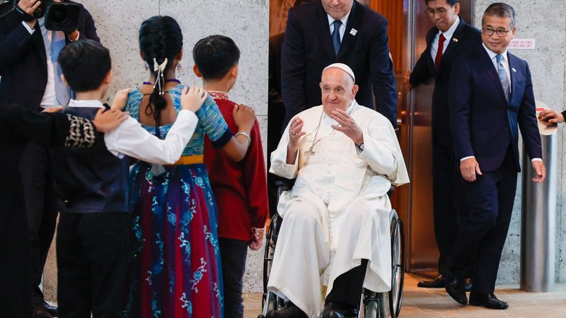 Pope Francis greets a group of children as he arrives Sept. 11, 2024, in Singapore, the last stop on his four-nation visit to Asia and the Pacific. (CNS photo/Lola Gomez)