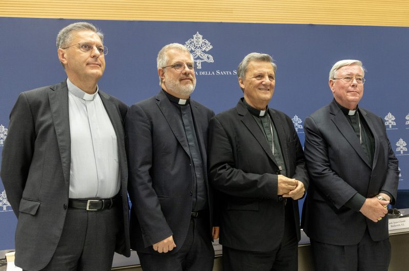 Members of the General Secretariat of the Synod pose for a photo after a news conference at the Vatican Sept. 16, 2024. From left to right, they are: Msgr. Riccardo Battocchio and Jesuit Father Giacomo Costa, both special secretaries for the synodal assembly; Cardinal Mario Grech, secretary-general of the synod; and Cardinal Jean-Claude Hollerich, relator general of the synod. (CNS/Pablo Esparza)