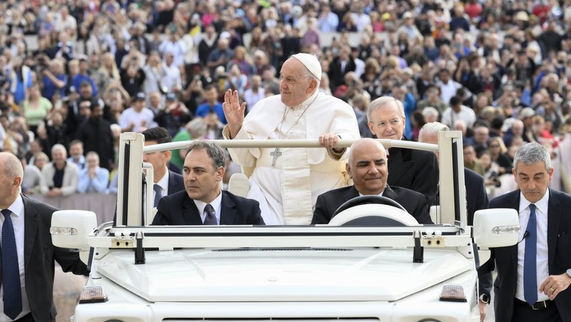 Pope Francis waves to visitors while riding the popemobile around St. Peter's Square before his general audience at the Vatican Oct. 16, 2024. (CNS photo/Vatican Media)