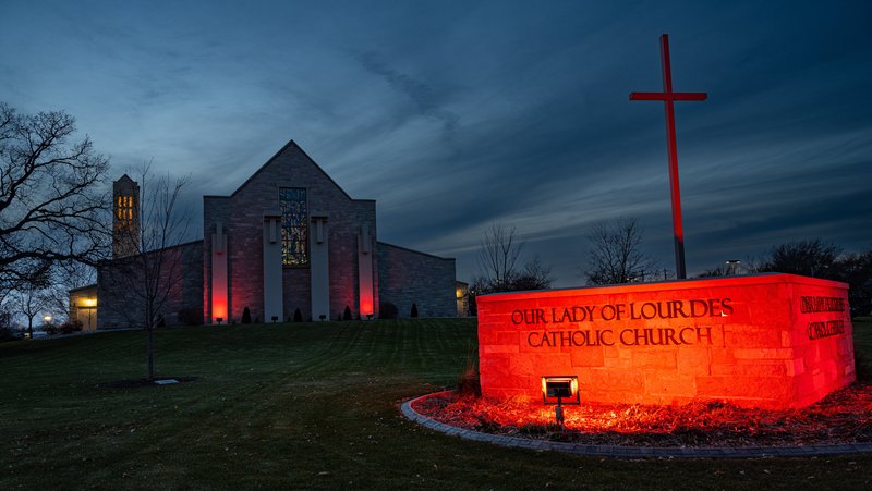 Our Lady of Lourdes Church in De Pere, Wis., is illuminated in red Nov. 16, 2023, during as part of the international Red Week campaign. The color represents the blood of Christian martyrs. Aid to the Church in Need's annual observance is a campaign that draws attention to the persecution of Christians and religious freedom violations around the world. Red Wednesday is observed Nov. 20 in 2024. (OSV News photo/Sam Lucero)