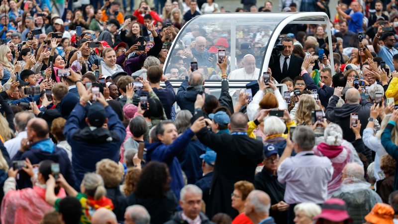 Pope Francis greets visitors as he rides in the popemobile around St. Peter's Square before his weekly general audience at the Vatican Oct. 23, 2024. (CNS photo/Lola Gomez)