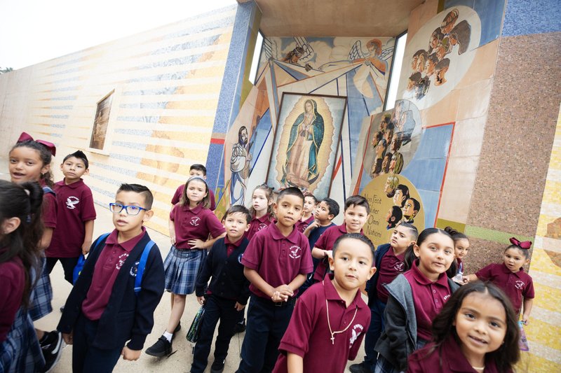 Students from Epiphany Catholic School in South El Monte pose outside the cathedral plaza after the annual Missionary Childhood Association Youth Appreciation Mass on Oct. 16. (Victor Alemán)