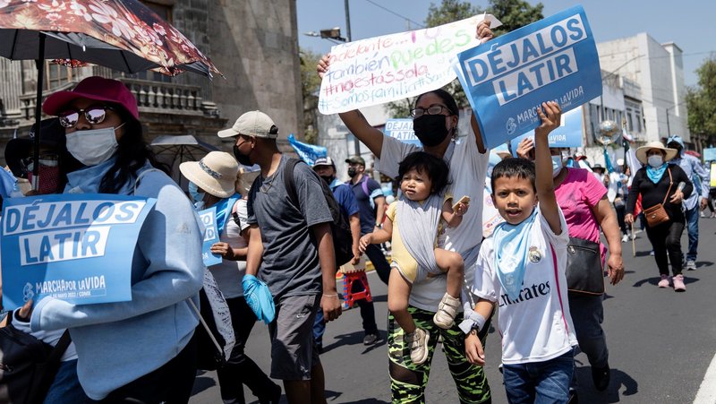 A young pro-life supporter and others hold signs as they participate in the March for Life in Mexico City May 7, 2022. (OSV News photo/Toya Sarno Jordan, Reuters)