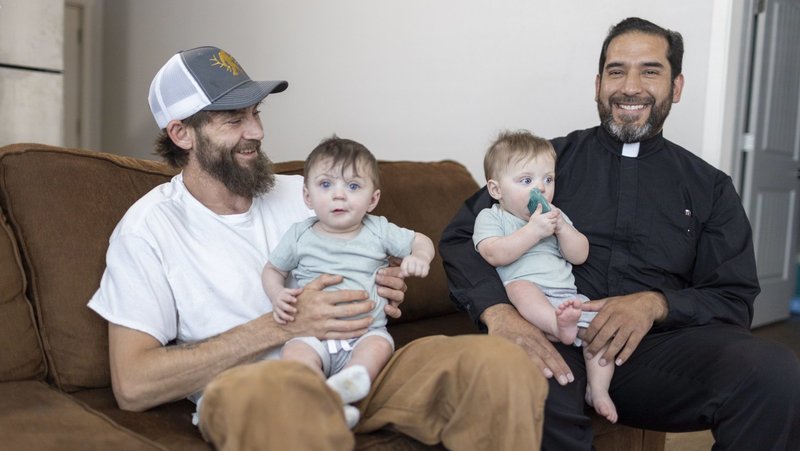 Father Jesús Mariscal, parochial vicar at St. Paul Cathedral in Yakima, Wash., poses July 9, 2024, with Lucius Moran, father of the twins he delivered Sept. 2, 2023, outside the cathedral. As Father Mariscal was leaving the rectory, on his way to purchase doughnuts for a marriage preparation meeting, he saw a pregnant woman in distress in front of a statue of Our Lady of Immaculate Conception. (OSV News photo/Catholic Extension)