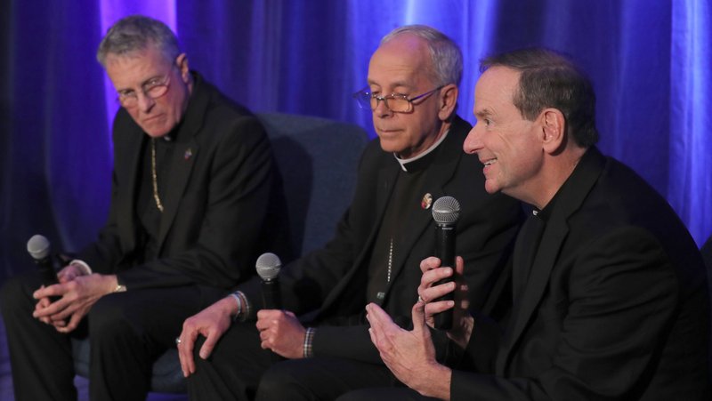 Bishop Michael F. Burbidge of Arlington, Va., gestures during a news conference at a Nov. 12, 2024, session of the fall general assembly of the U.S. Conference of Catholic Bishops in Baltimore. Also pictured are Archbishop Timothy P. Broglio of the U.S. Archdiocese for the Military Services, president of the USCCB, and Bishop Mark J. Seitz of El Paso, Texas. (OSV News photo/Bob Roller)